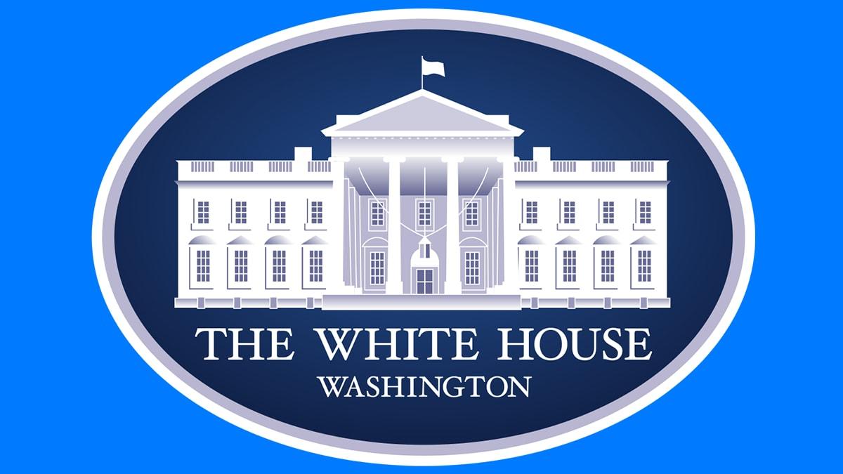 The image depicts a stylized representation of The White House, located in Washington, D.C. Dominated by shades of blue, the graphic showcases the iconic White House facade with its signature pillars, balconies, and flag atop. The building sits centered within a circular frame, and the text "THE WHITE HOUSE" is prominently displayed at the bottom, accompanied by the word "WASHINGTON" just below it.